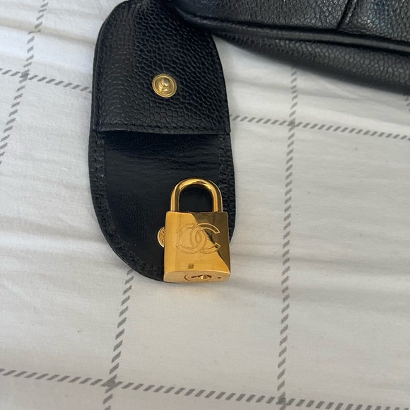 Chanel black leather bag with gold chain handle.There is a small cut on lock tag - Picture 11 of 14